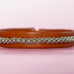 Brown leather bracelet with beads.