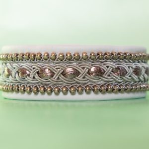 White bracelet with beads.