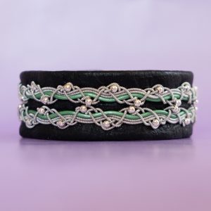 Black tin thread bracelet with ornaments.