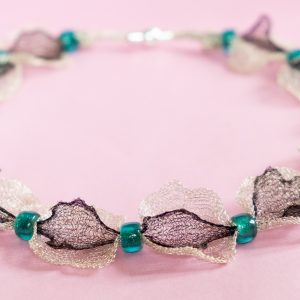 Pre-knitted wire necklace.